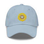 Heart-centered golden sunflower embroidered baseball cap in light blue, front view – Kate Spain design