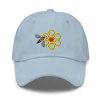 Honey bee and golden honeycomb embroidered baseball cap in light blue, front view – Kate Spain design