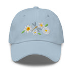 Dragonfly and white daisies embroidered baseball cap in light blue, front view – Kate Spain design