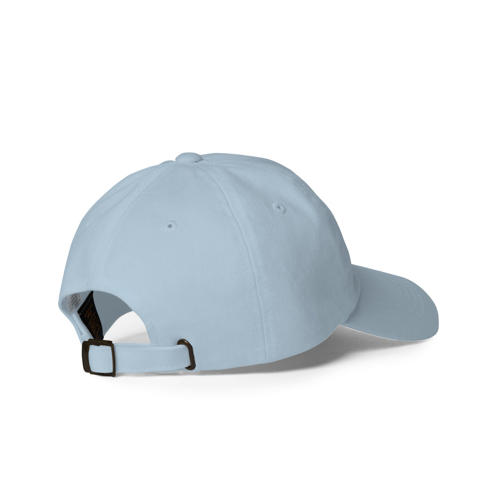 Heart-centered golden sunflower embroidered baseball cap in light blue, angled back view – Kate Spain design