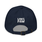 Law of the Paw® dog paw print embroidered baseball cap in navy, back view with Law of the Paw logo – Kate Spain design