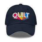 Colorful “QUILT” lettering embroidered baseball cap in navy, front view – Kate Spain Moda Quilt design