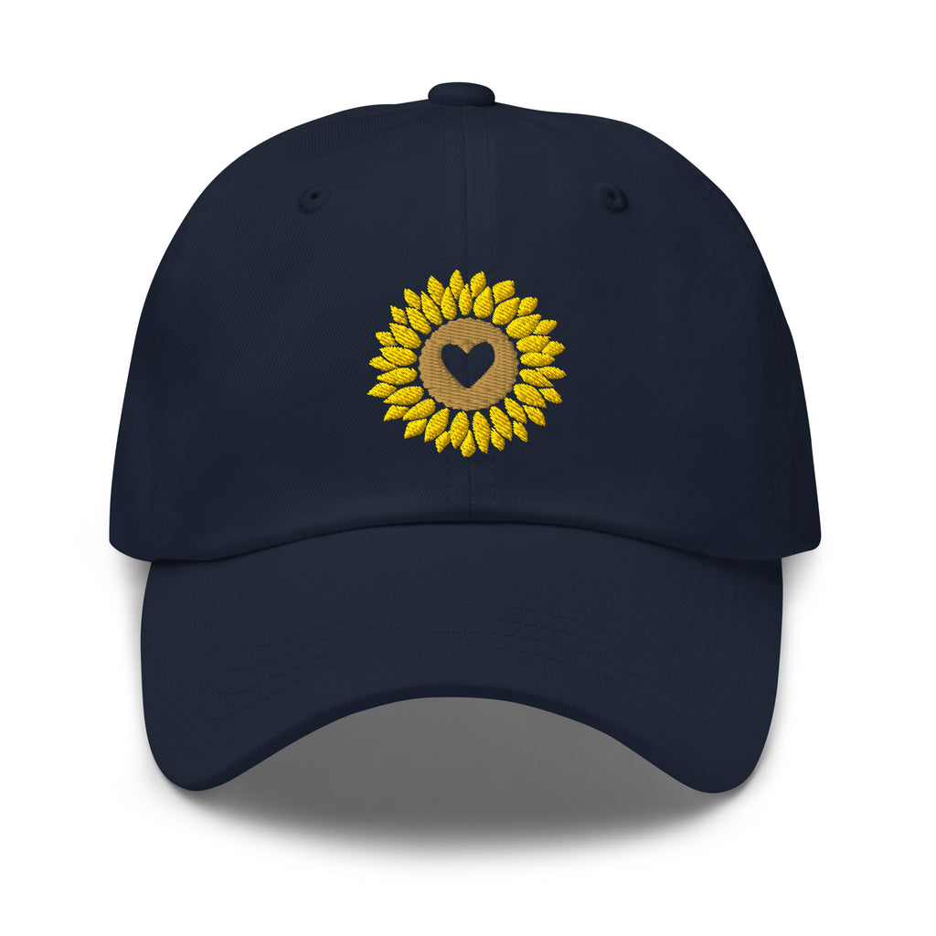 Heart-centered golden sunflower embroidered baseball cap in navy, front view – Kate Spain design