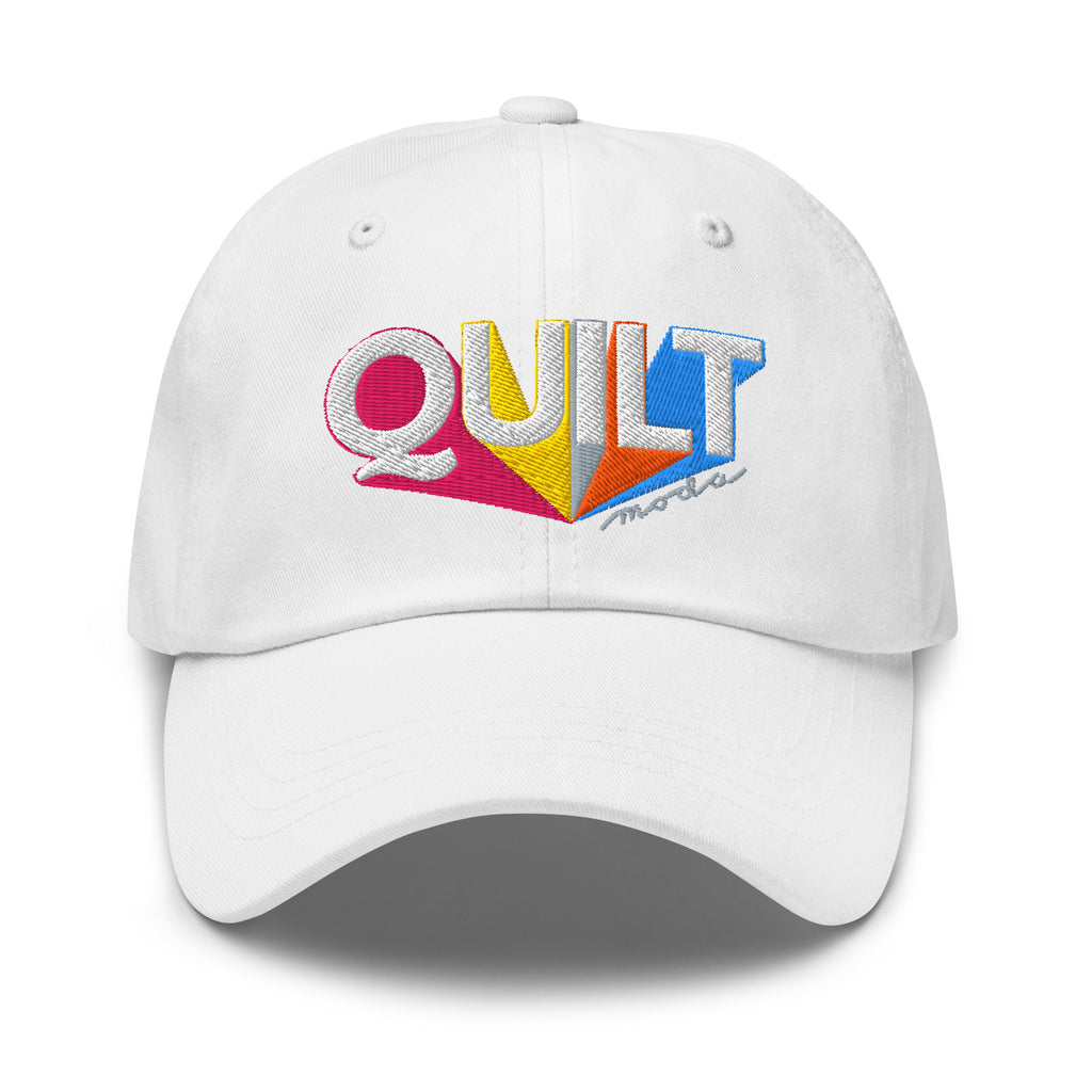 Colorful “QUILT” lettering embroidered baseball cap in white, front view – Kate Spain Moda Quilt design