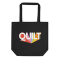 Moda QUILT logo with orange, pink, blue and yellow rays on a black organic cotton tote bag, front view – Kate Spain design