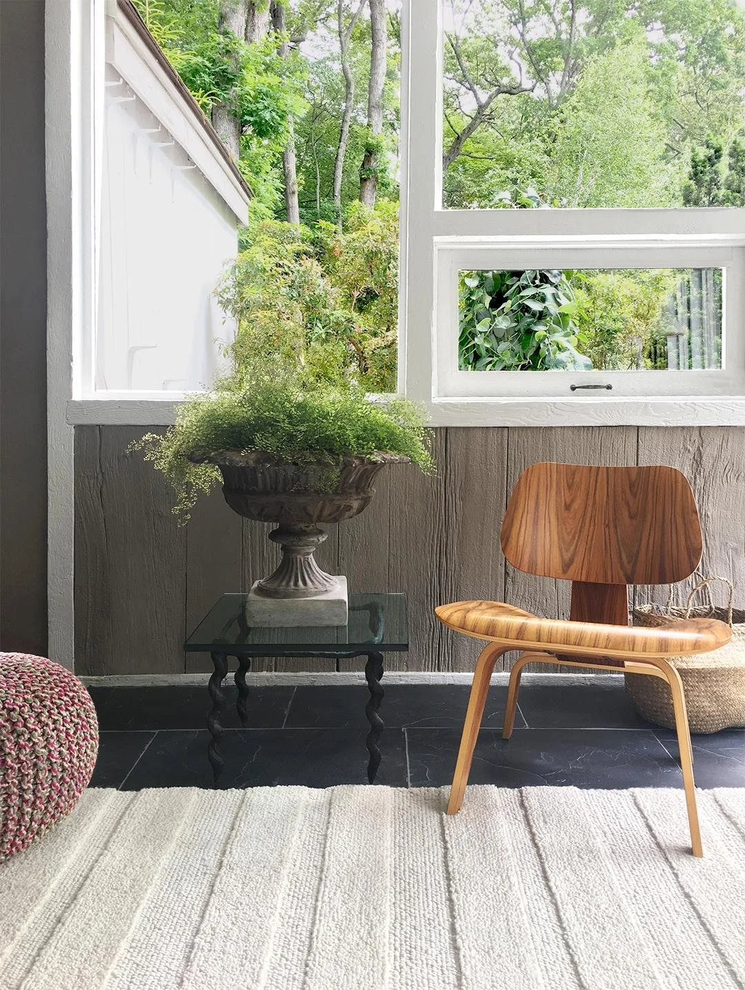eye heart hand Pure Stripe hand-tufted rug in undyed natural white wool with subtle tonal stripes, in a sunroom with a molded plywood chair – Kate Spain design
