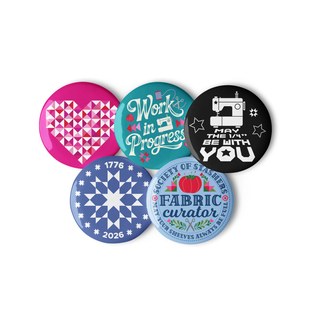 Sloan Zone Celebration pin button set of five with patchwork heart, Work in Progress, May the ¼" Be With You, 1776–2026 quilt star and Fabric Curator designs, 2.25 inch buttons grouped together – Kate Spain design for Pat Sloan