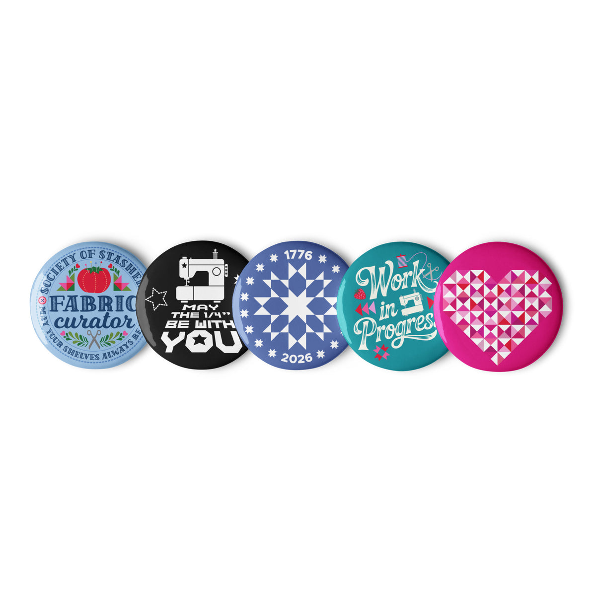 Sloan Zone Celebration pin button set of five with patchwork heart, Work in Progress, May the ¼" Be With You, 1776–2026 quilt star and Fabric Curator designs, 2.25 inch buttons in a row – Kate Spain design for Pat Sloan