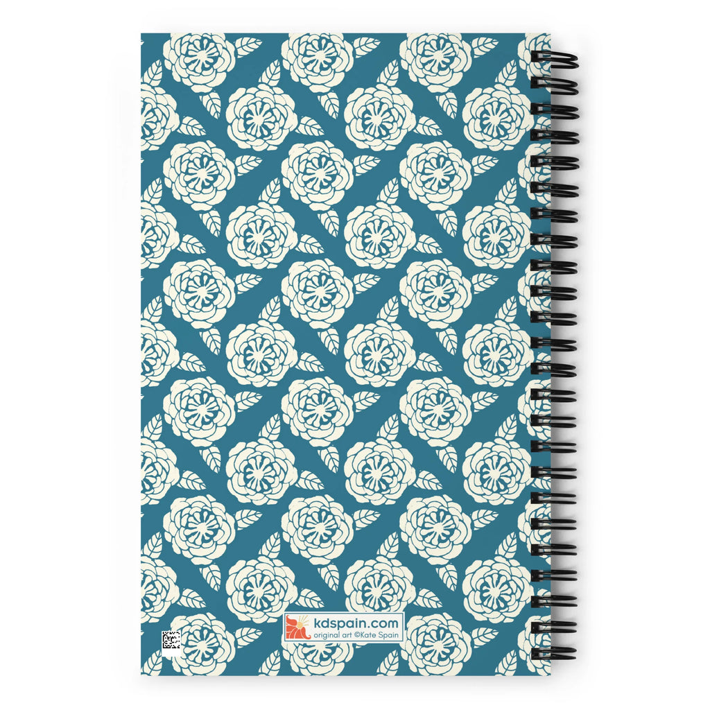 Meadow spiral notebook in Dew, repeating cream roses on steel blue, back cover with kdspain.com label – Kate Spain design