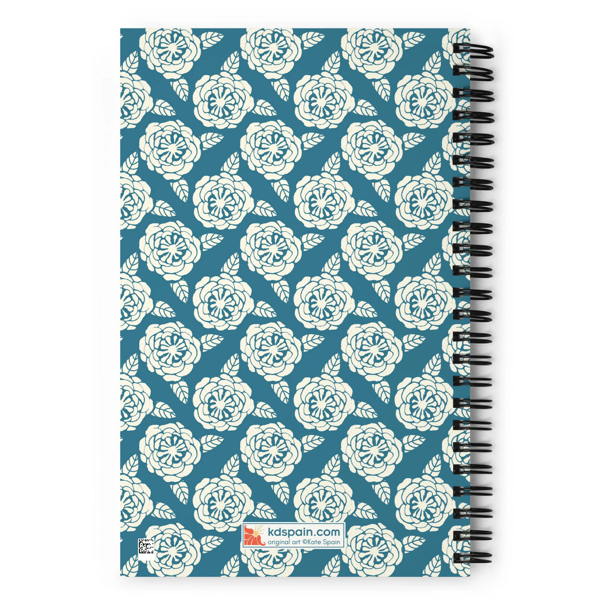 Meadow spiral notebook in Dew, repeating cream roses on steel blue, back cover with kdspain.com label – Kate Spain design