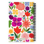 Happy Blooms spiral notebook with bright flat-color tulips, daisies, a butterfly and a ladybug on cream, back cover with kdspain.com label – Kate Spain design
