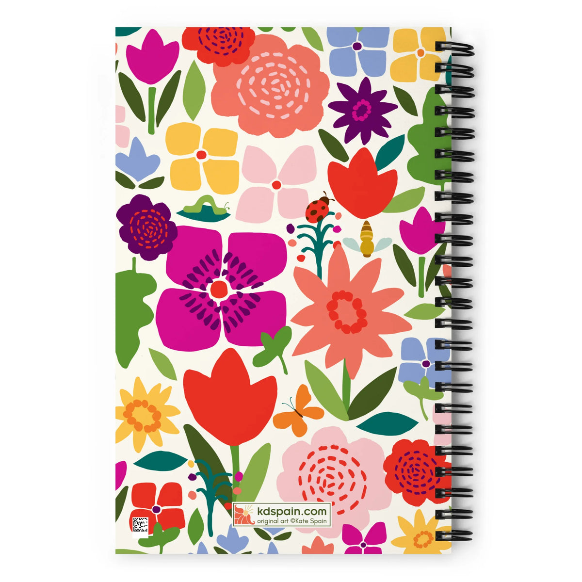 Happy Blooms spiral notebook with bright flat-color tulips, daisies, a butterfly and a ladybug on cream, back cover with kdspain.com label – Kate Spain design