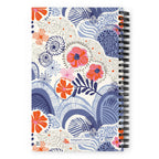 Hills + Valleys spiral notebook with layered periwinkle hills dotted with orange, coral and pink flowers on cream, back cover with kdspain.com label – Kate Spain design