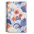 Hills + Valleys spiral notebook with layered periwinkle hills dotted with orange, coral and pink flowers on cream, front cover – Kate Spain design