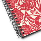 Meadow spiral notebook in Poppy, close-up of the spiral binding with red block-print flowers – Kate Spain design