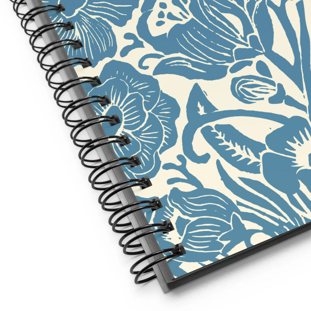 Meadow spiral notebook in Dew, close-up of the spiral binding with blue block-print flowers – Kate Spain design