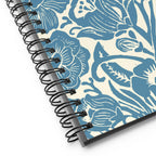Meadow spiral notebook in Dew, close-up of the spiral binding with blue block-print flowers – Kate Spain design