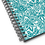 Earth spiral notebook in Turquoise, turquoise block-print medallions on cream, close-up of the spiral binding – Kate Spain design