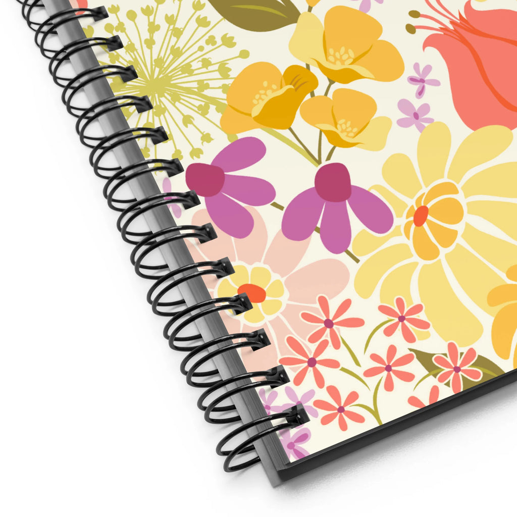 North Meadow spiral notebook with yellow, coral and mauve garden flowers with olive leaves on cream, close-up of the spiral binding – Kate Spain design