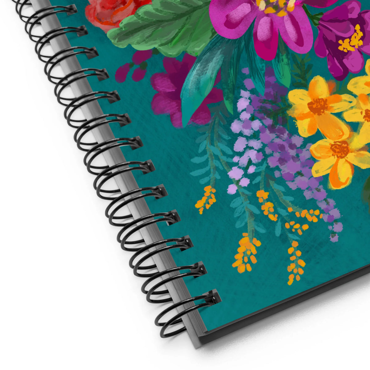 Posy spiral notebook with a painterly bouquet of magenta, yellow, pink and red flowers on deep teal, close-up of the spiral binding – Kate Spain design