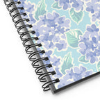 Nantucket Hydrangea spiral notebook with soft lavender-blue hydrangeas and mint leaves on pale aqua, close-up of the spiral binding – Kate Spain design
