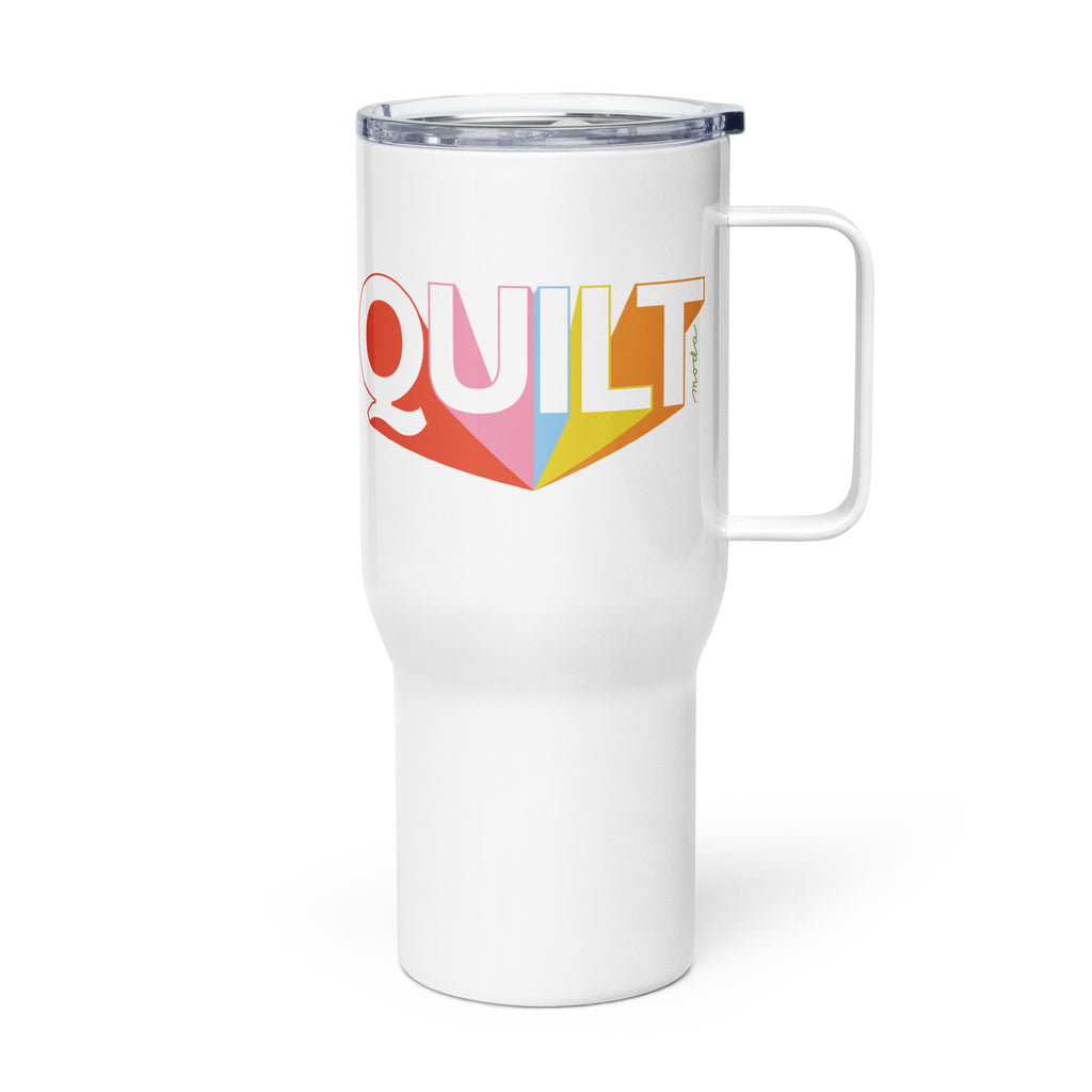 Moda QUILT logo on a white 25 ounce travel mug with a handle, handle on the left – Kate Spain design