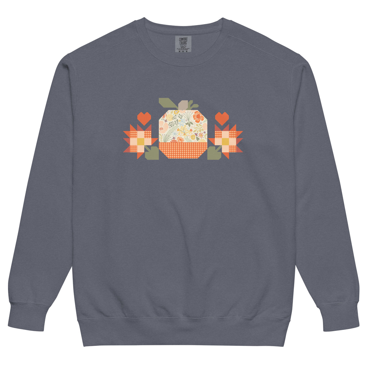 Falling for Fall patchwork pumpkin with quilt-block stars and hearts on a garment-dyed crewneck sweatshirt in denim blue, front view – Kate Spain design for Pat Sloan