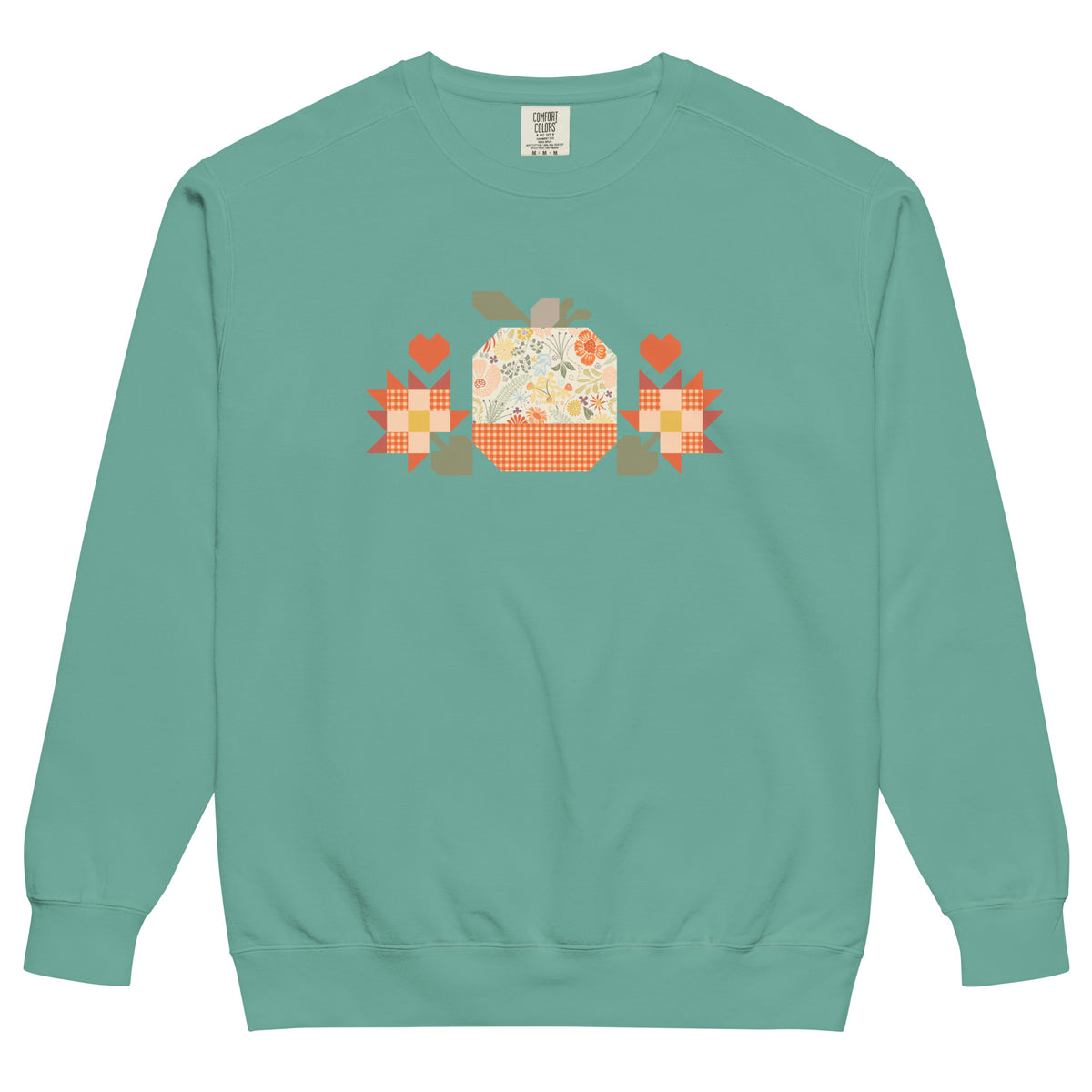Falling for Fall patchwork pumpkin with quilt-block stars and hearts on a garment-dyed crewneck sweatshirt in seafoam, front view – Kate Spain design for Pat Sloan