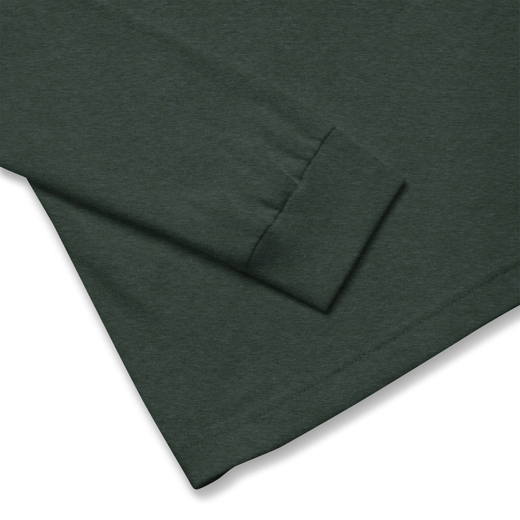Let It Snow snowflake quilt block on a long sleeve t-shirt in heather forest green, close-up of the sleeve cuff – Kate Spain design for Pat Sloan