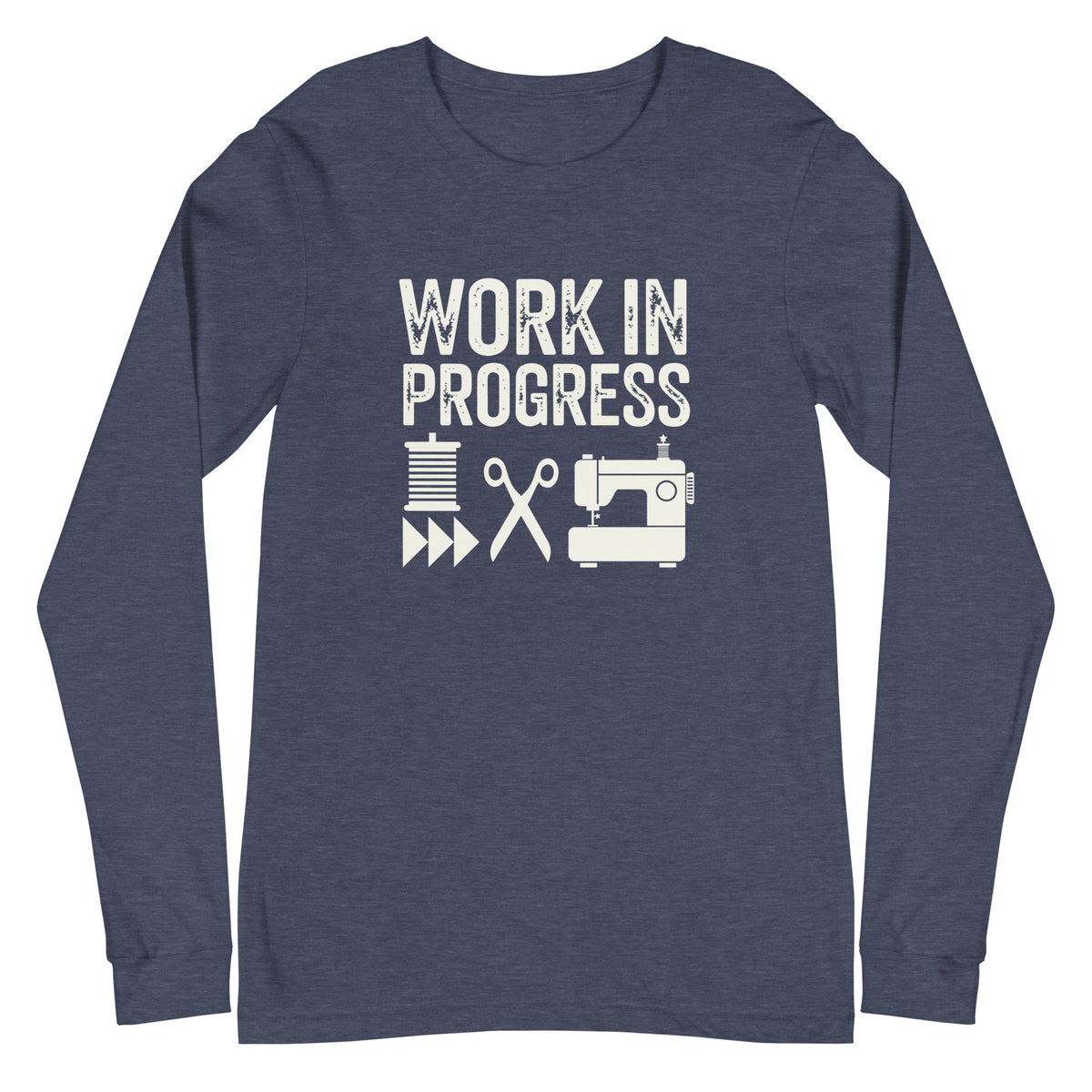 Work in Progress lettering with spool, scissors and sewing machine icons on a unisex long-sleeve tee in heather navy, front view – Kate Spain design for Pat Sloan