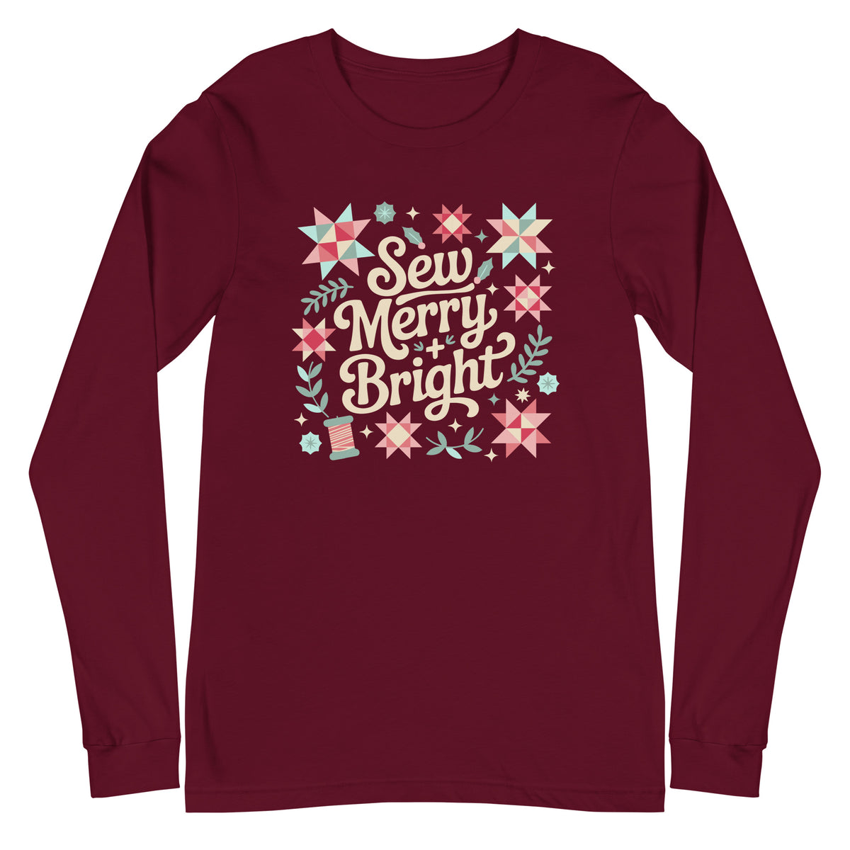 Sew Merry + Bright lettering with quilt stars, holly and a spool on a unisex long-sleeve tee in maroon, front view – Kate Spain design for Pat Sloan
