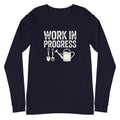 Garden Work in Progress distressed lettering with a shovel, pitchfork and watering can on a long sleeve t-shirt in navy, front view – Kate Spain design