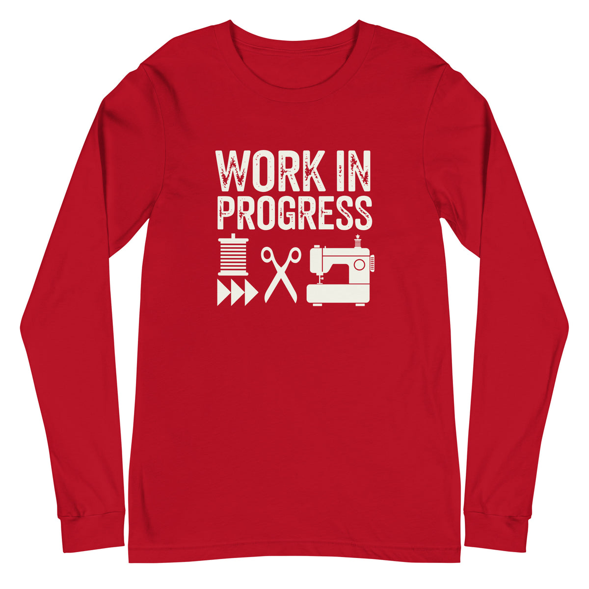 Work in Progress lettering with spool, scissors and sewing machine icons on a unisex long-sleeve tee in red, front view – Kate Spain design for Pat Sloan