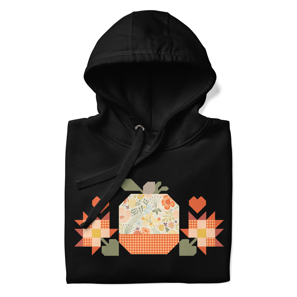 Falling for Fall patchwork pumpkin with quilt-block stars and hearts on a pullover hoodie in black, folded close-up of the design – Kate Spain design for Pat Sloan