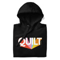 Moda QUILT logo with orange, pink, blue and yellow rays on a premium hoodie in black, folded close-up of the design – Kate Spain design