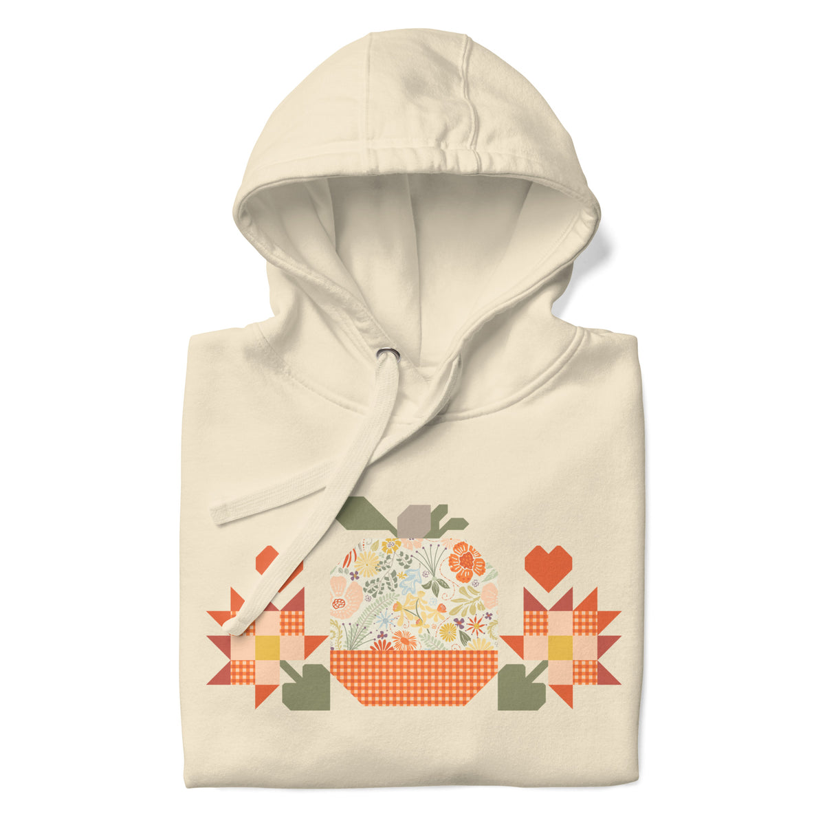 Falling for Fall patchwork pumpkin with quilt-block stars and hearts on a pullover hoodie in vintage white, folded close-up of the design – Kate Spain design for Pat Sloan