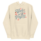 Work in Progress sewing design with flying geese, sewing machine, strawberry and thread spool on a pullover hoodie in vintage white, front view – Kate Spain design for Pat Sloan
