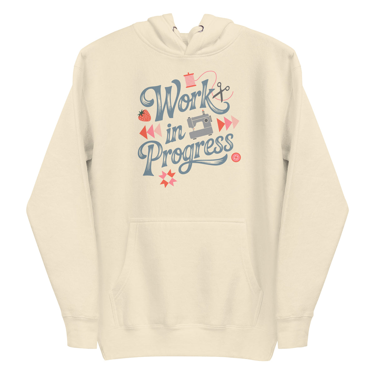 Work in Progress sewing design with flying geese, sewing machine, strawberry and thread spool on a pullover hoodie in vintage white, front view – Kate Spain design for Pat Sloan