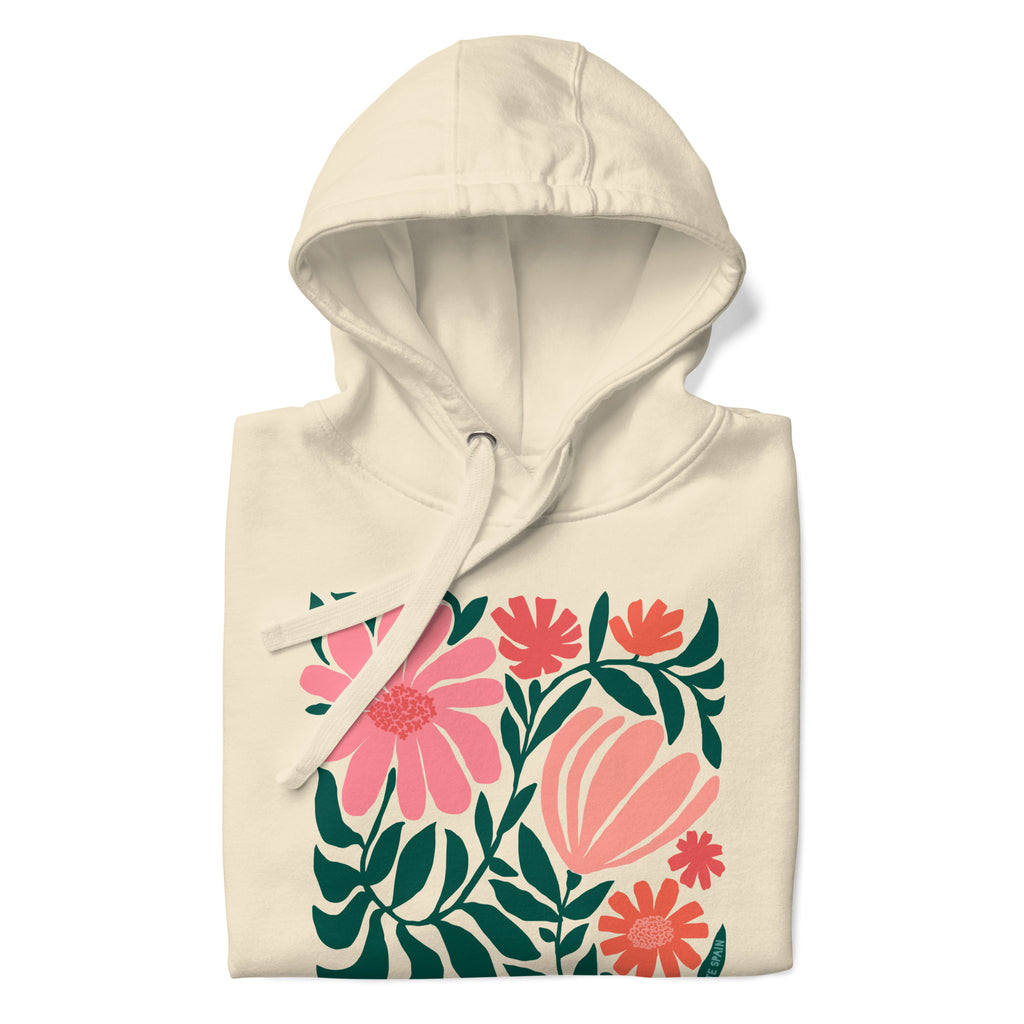 Botanica modern floral design with pink and coral blooms on a pullover hoodie in vintage white, folded close-up of the design – Kate Spain design