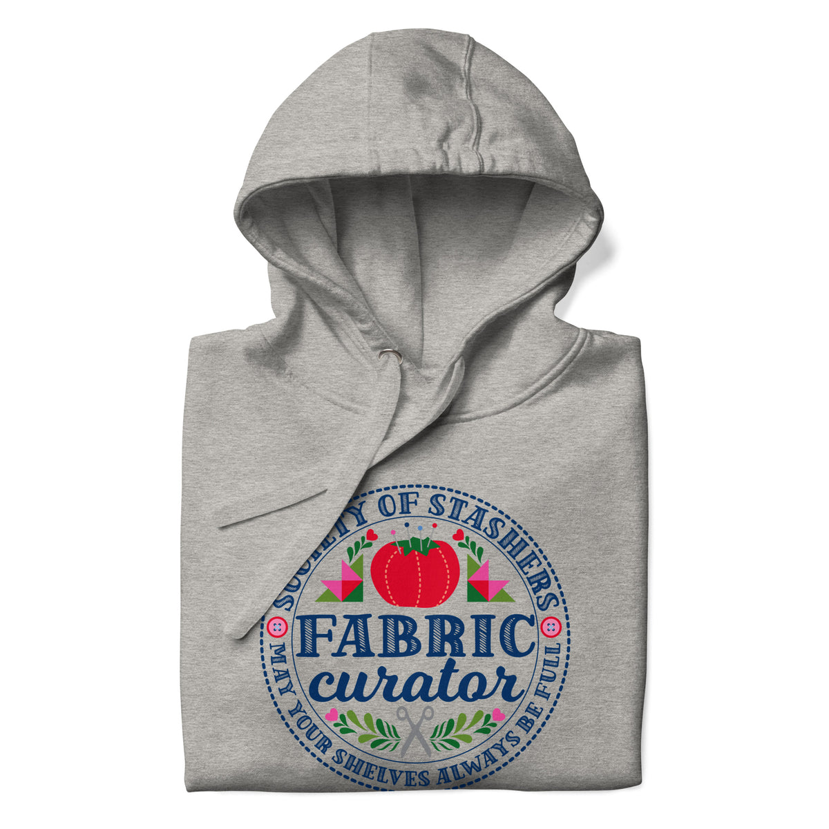Fabric Curator Society of Stashers badge with a tomato pincushion on a pullover hoodie in athletic grey, folded close-up of the design – Kate Spain design for Pat Sloan