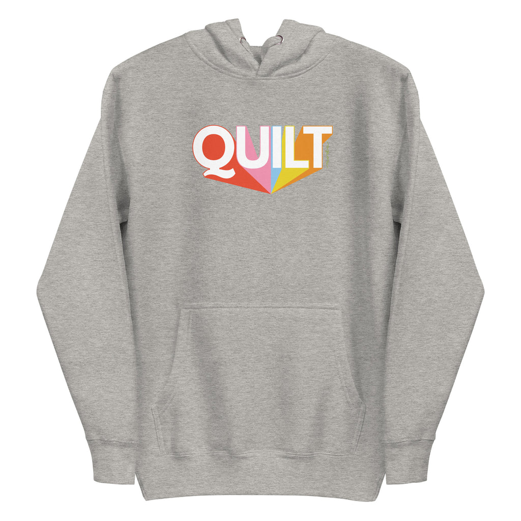 Moda QUILT logo with orange, pink, blue and yellow rays on a premium hoodie in athletic grey, front view – Kate Spain design