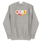Moda QUILT logo with orange, pink, blue and yellow rays on a premium hoodie in athletic grey, front view – Kate Spain design