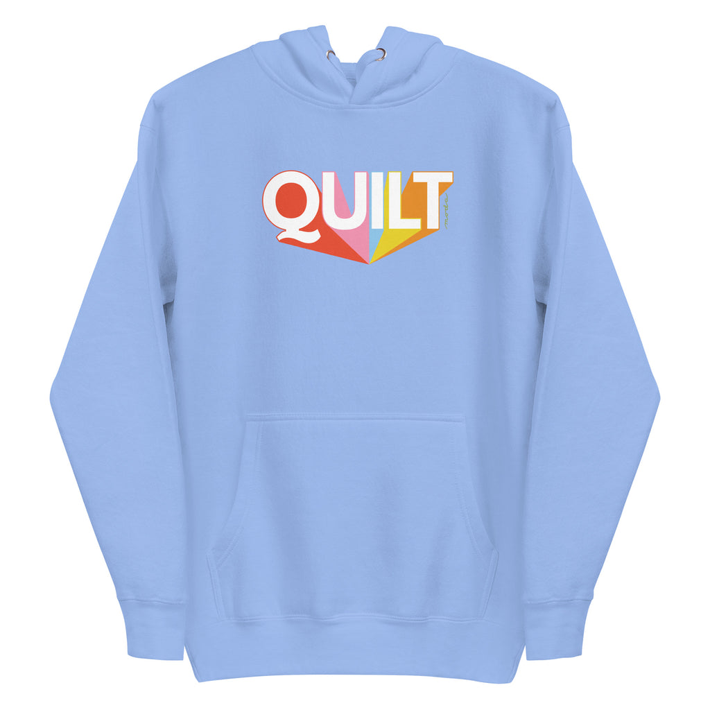 Moda QUILT logo with orange, pink, blue and yellow rays on a premium hoodie in Carolina blue, front view – Kate Spain design