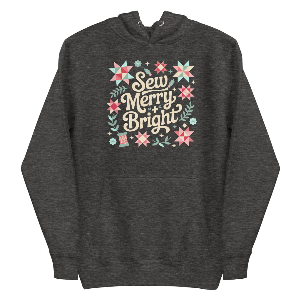 Sew Merry + Bright lettering with quilt-block stars, holly and a thread spool on a pullover hoodie in charcoal grey, front view – Kate Spain design for Pat Sloan