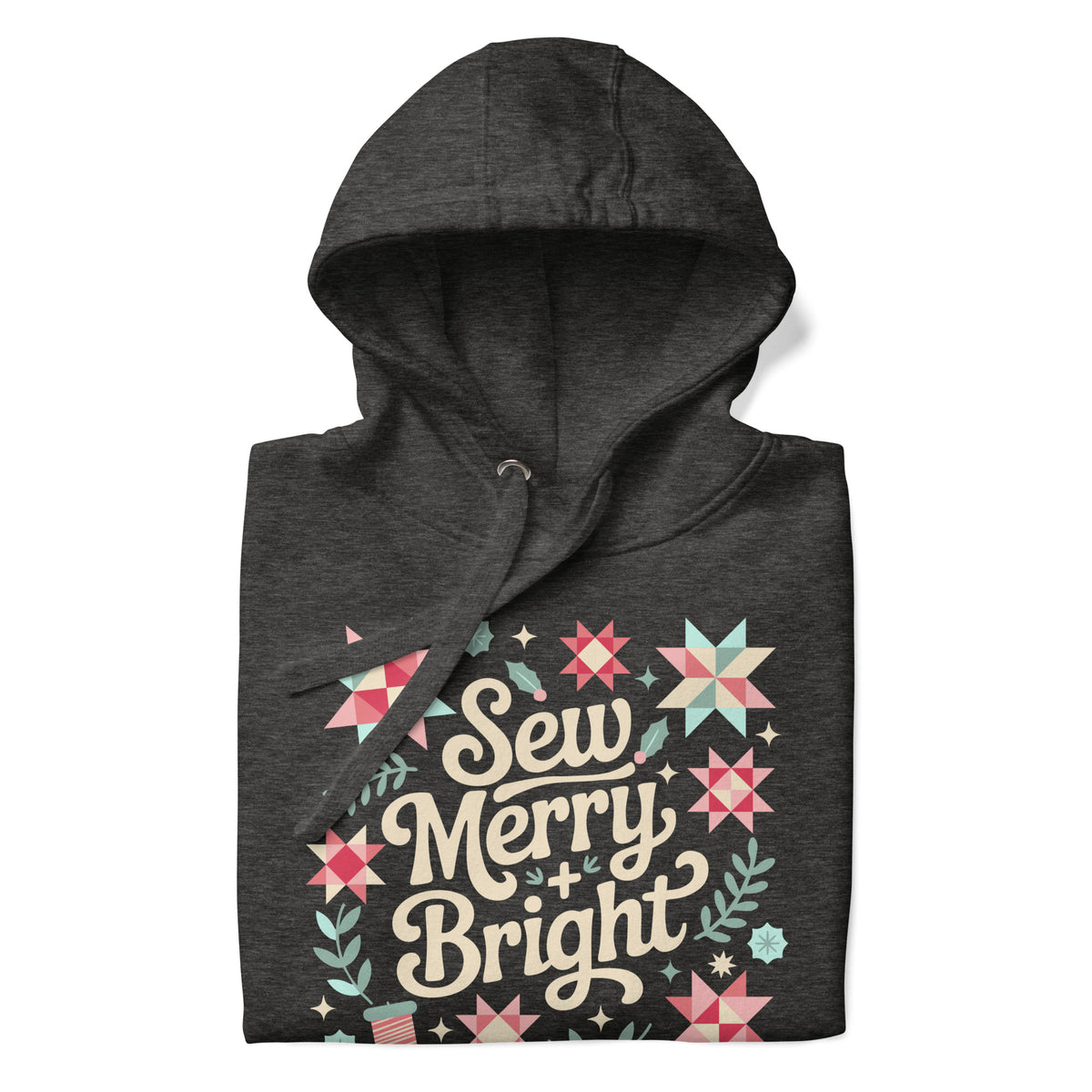 Sew Merry + Bright lettering with quilt-block stars, holly and a thread spool on a pullover hoodie in charcoal grey, folded close-up of the design – Kate Spain design for Pat Sloan