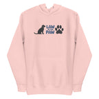 Law of the Paw® logo with seated dog and paw print on a pullover hoodie in pink, front view – Kate Spain design