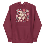 Sew Merry + Bright lettering with quilt-block stars, holly and a thread spool on a pullover hoodie in maroon, front view – Kate Spain design for Pat Sloan