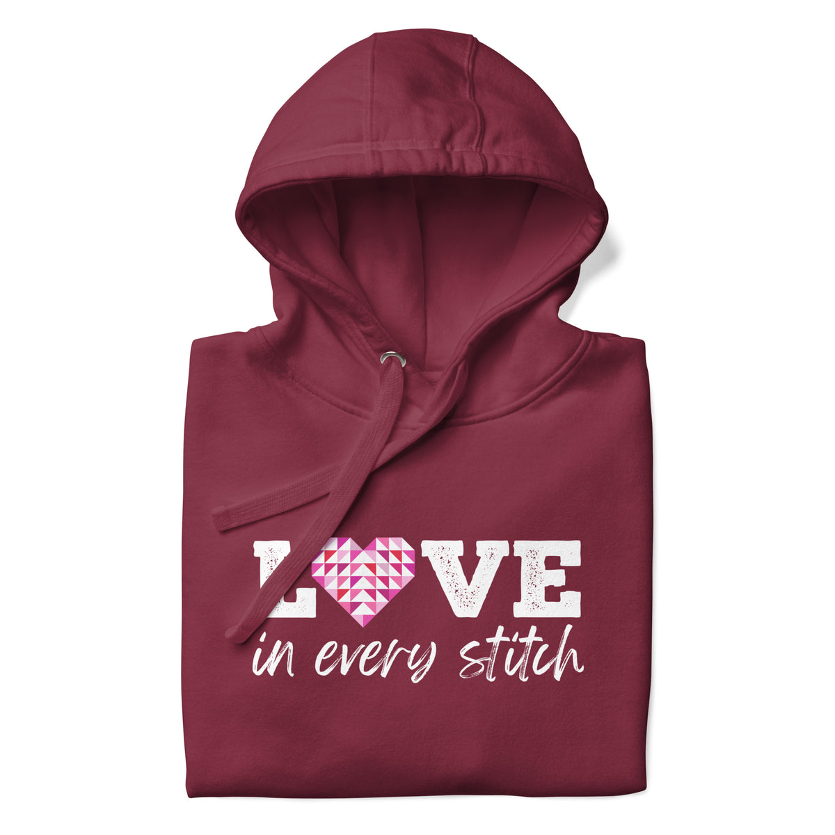 Love in Every Stitch distressed lettering on a pullover hoodie in maroon, folded close-up of the design – Kate Spain design for Pat Sloan