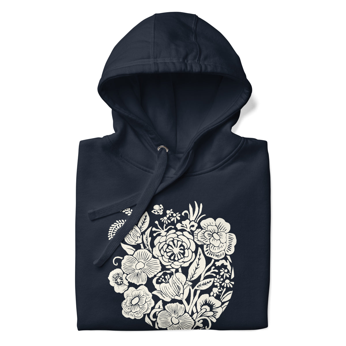 Meadowsweet woodblock-style bouquet of wildflowers on a pullover hoodie in navy, folded close-up of the design – Kate Spain design