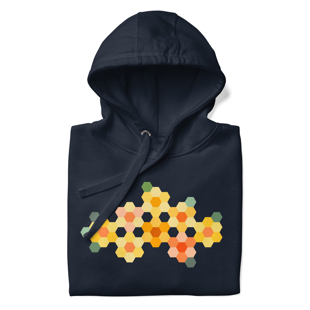Yellow GeoFlora hexagon flowers in golden yellow, orange, coral and sage on a pullover hoodie in navy, folded close-up of the design – Kate Spain design for Pat Sloan